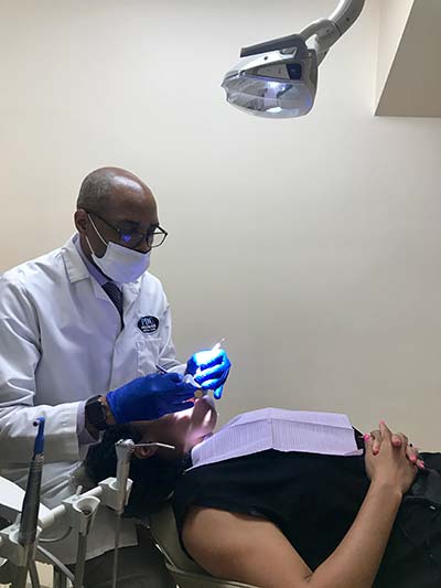 Dr. Hines performing an emergency dental procedure in Washington, DC