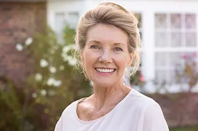 woman smiling after getting dentures from Premier Dental Care in Washington, DC